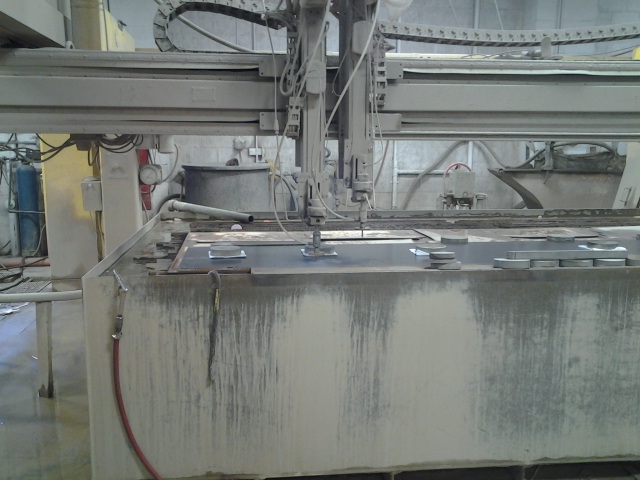 A panel being cut in the water jet machine